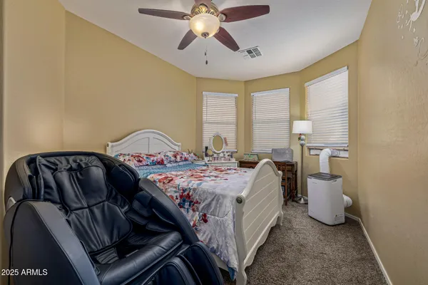 a bedroom with a bed and window