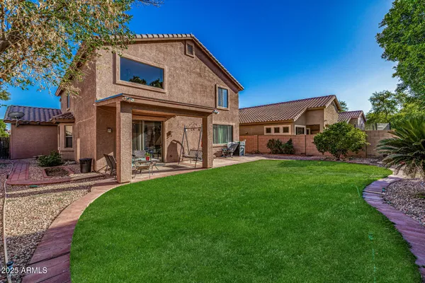 a view of a car park in front of house