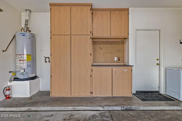 a view of a livingroom with wooden floor and cabinet