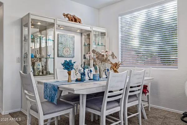 a dining room with furniture and window