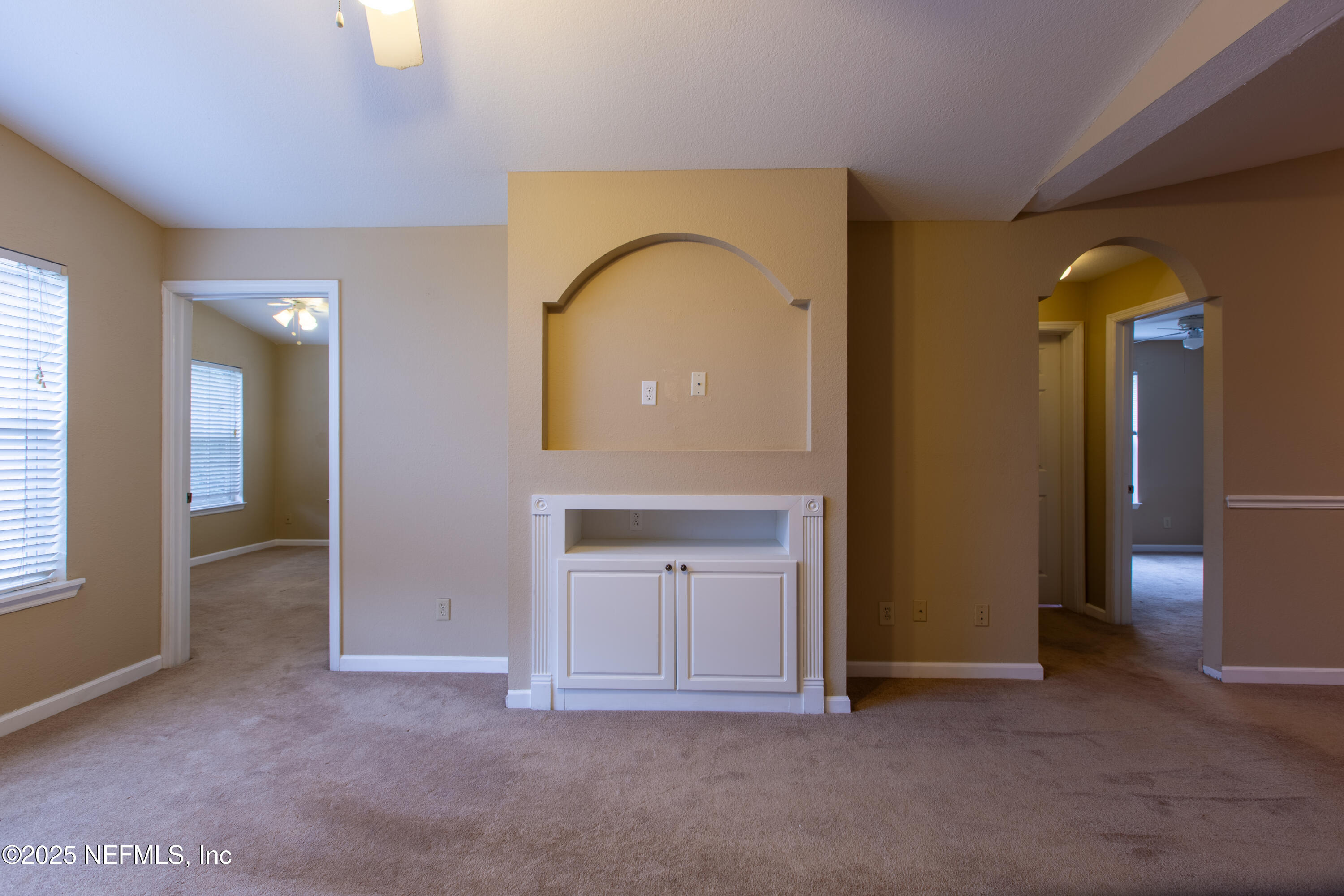 13810 Sutton Park Drive North, Unit 1120 Jacksonville, FL 32224 - Photo 13 of 24 an empty room with windows and closet