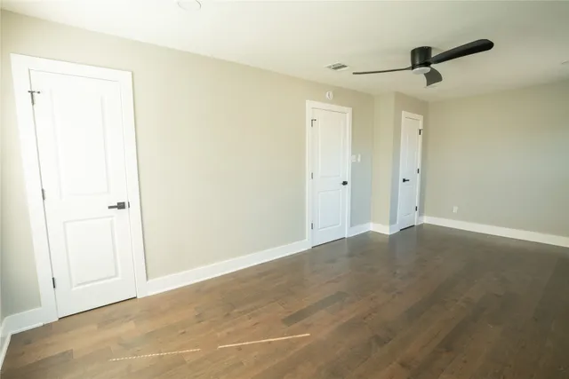 a view of a room with a ceiling fan