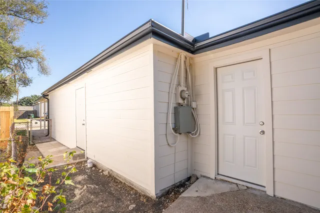 a bathroom with a shower and a sink