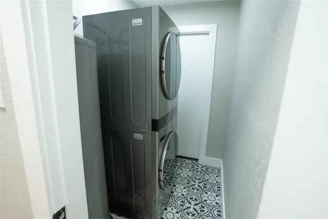 a bathroom with a glass door shower and a mirror