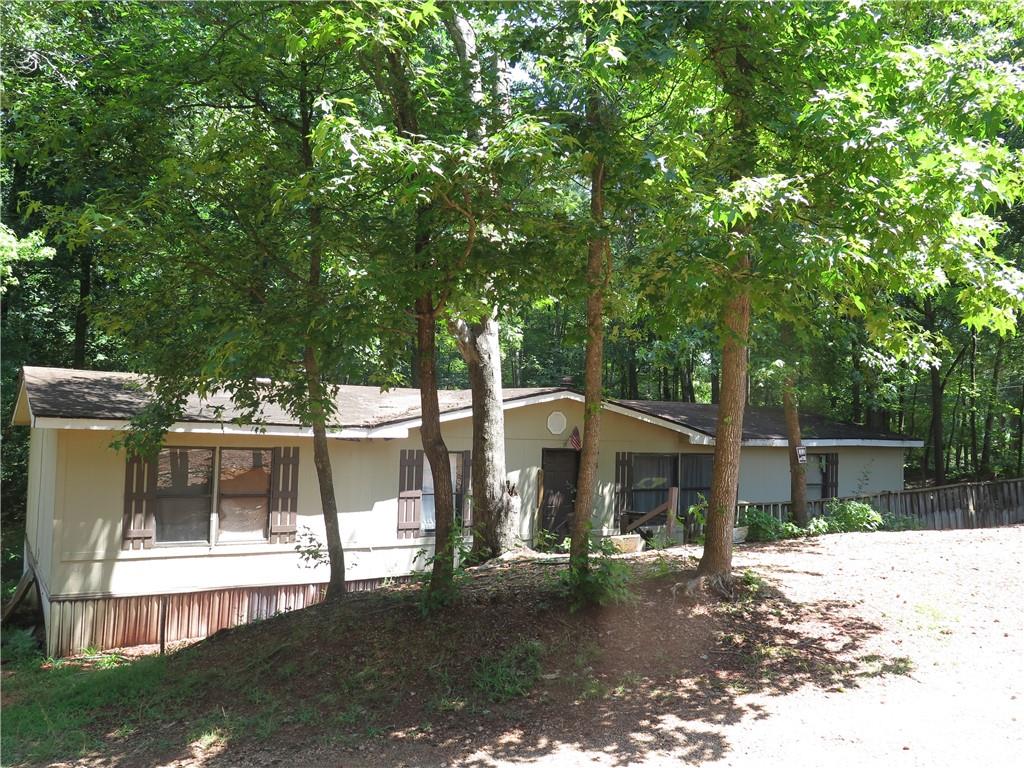 2926-ab Wallace Road Gainesville, GA 30507 - Photo 1 of 1 a view of a barn with a large tree