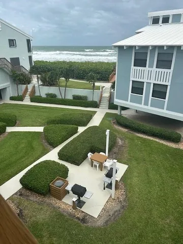 a view of a swimming pool with an outdoor seating