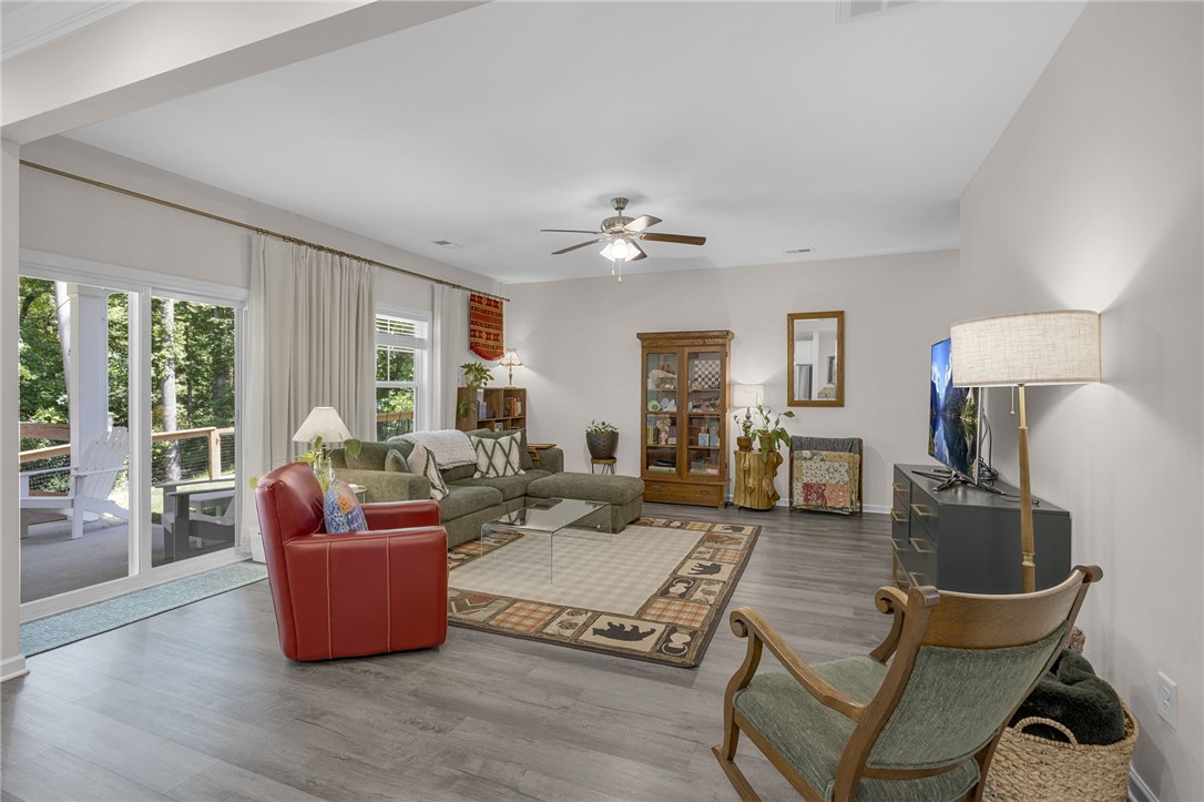 430 Johnson Road Central, SC 29630 - Photo 2 of 36 Sun-drenched living space boasts wide plank flooring and seamless outdoor access.
