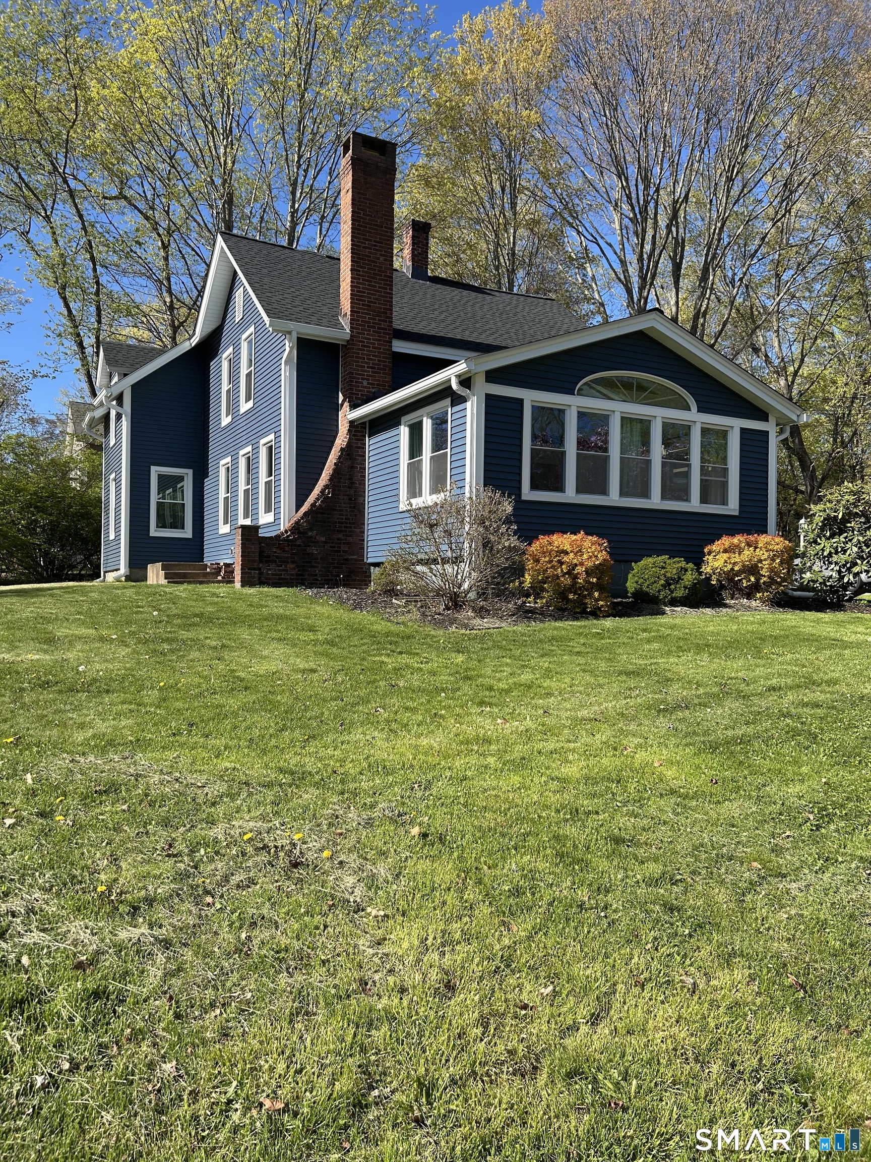 24 North Main Street, Unit 2 East Hampton, CT 06424 - Photo 1 of 1 a front view of a house with a yard