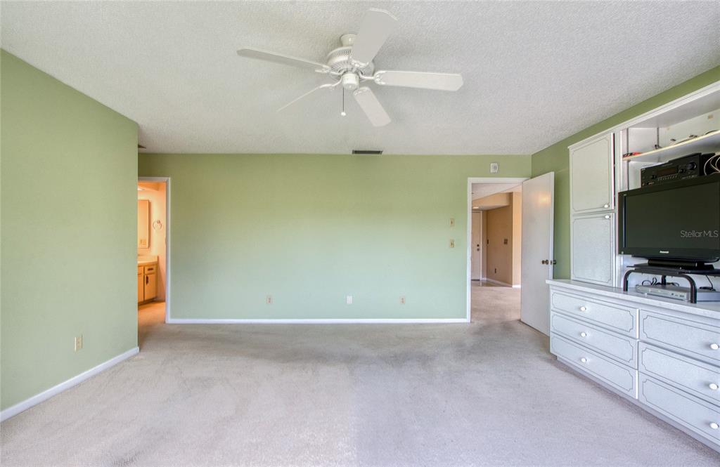 700 Starkey Road, Unit 1145 Largo, FL 33771 - Photo 24 of 63 a view of an empty room with a flat screen tv
