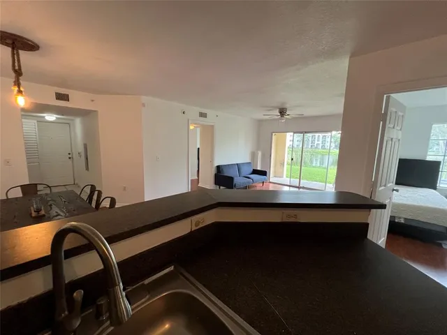 a room with a table chairs and a bed