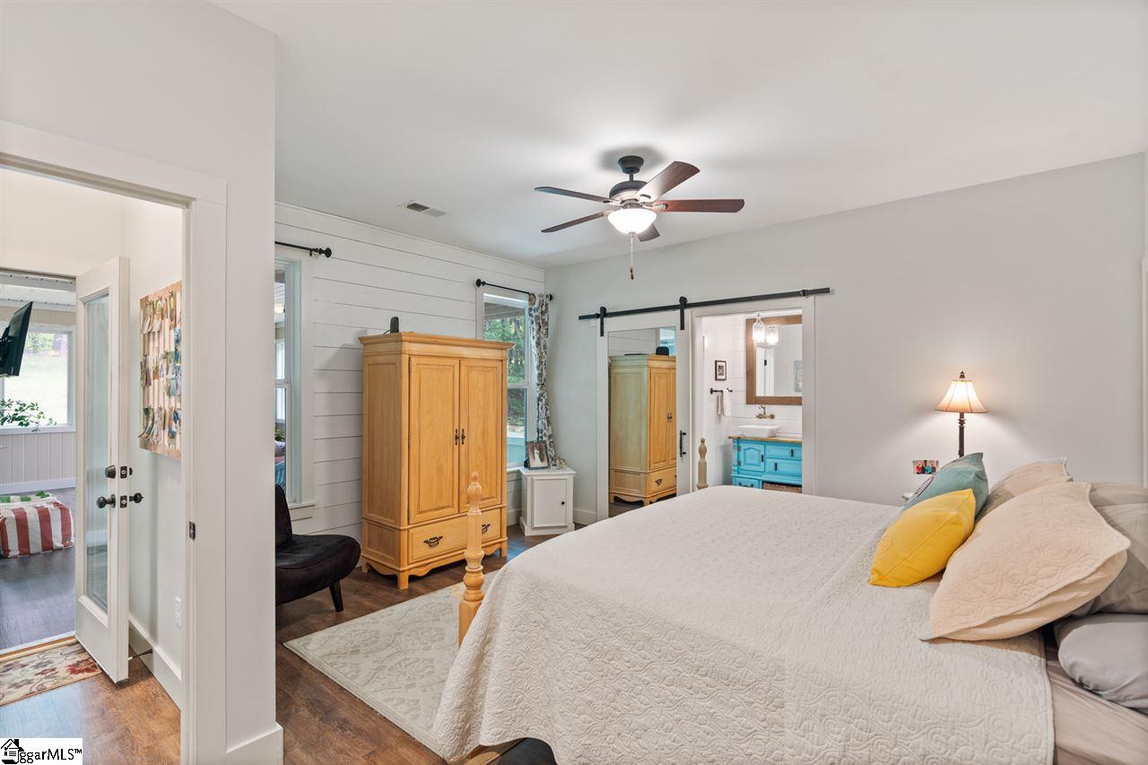 940 Bailey Mill Road Travelers Rest, SC 29690 - Photo 22 of 36 Beautiful LV floors with mirrored barn door. Roomy and bright!
