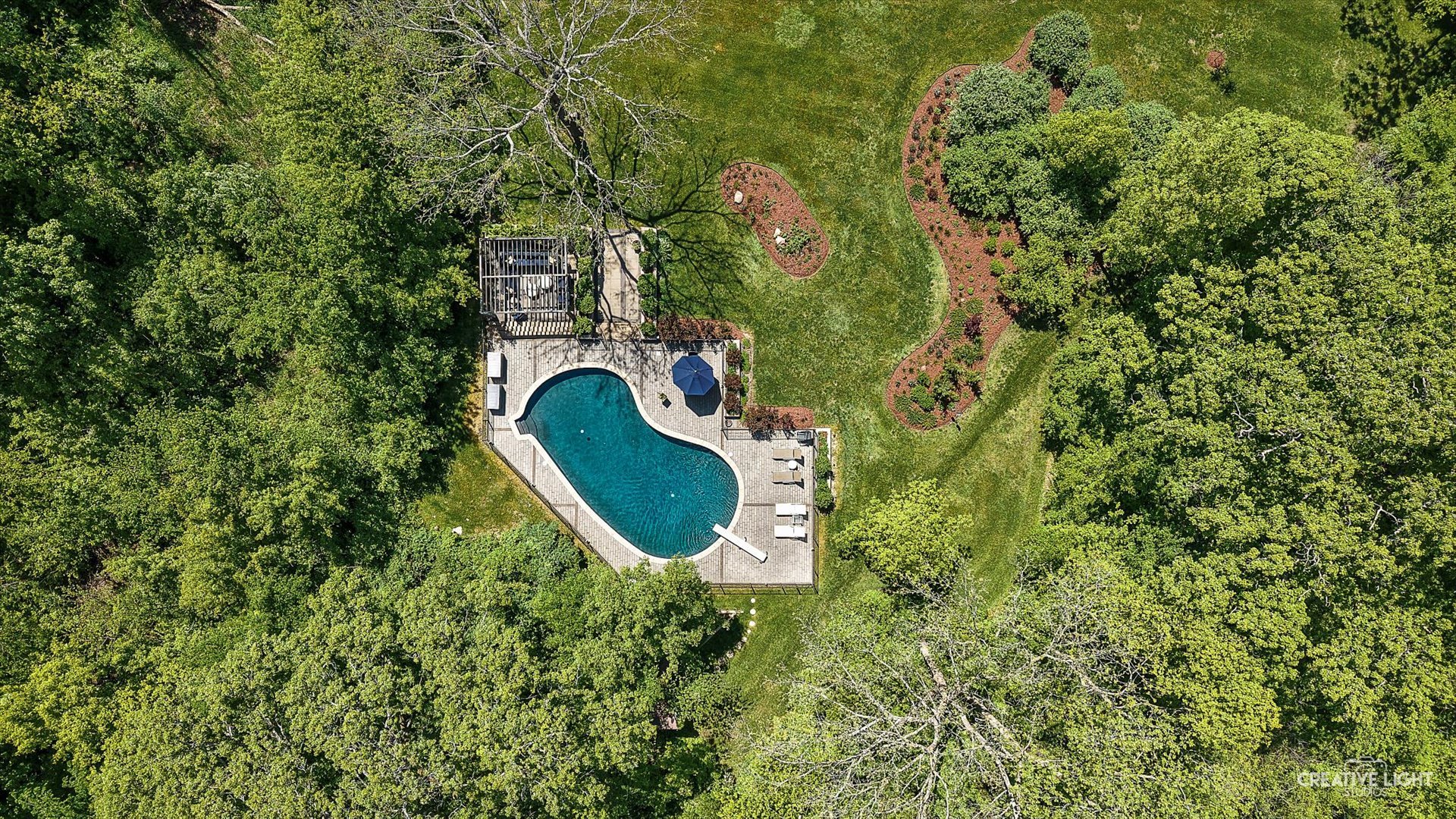 5N477 Curling Pond Road Wayne, IL 60184 - Photo 51 of 67 an aerial view of a house with swimming pool and green space