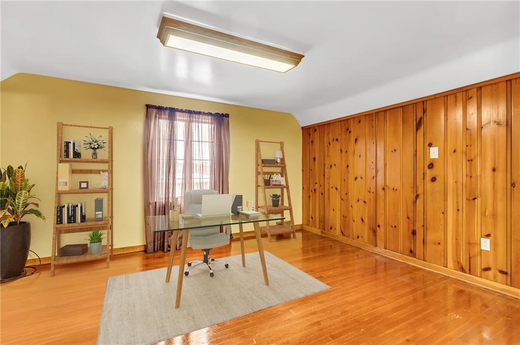156 McIntyre Road Pittsburgh, PA 15237 - Photo 15 of 23 upper level bedroom staged as office. behind panel walls is a massive amount of storage space.