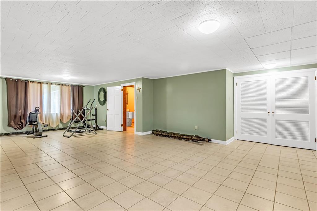 156 McIntyre Road Pittsburgh, PA 15237 - Photo 18 of 23 Massive Finished lower level with a large sorage space and laundry.