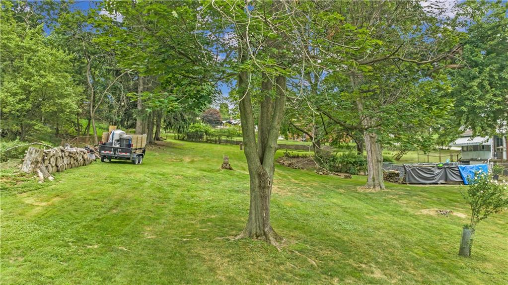 156 McIntyre Road Pittsburgh, PA 15237 - Photo 20 of 23 The scenic backyard boasts beautiful mature trees.