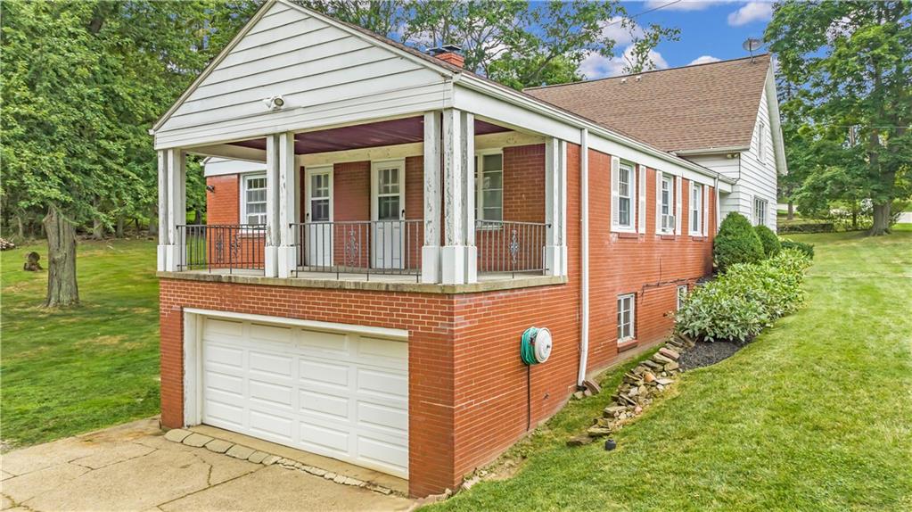 156 McIntyre Road Pittsburgh, PA 15237 - Photo 21 of 23 covered side porch with access to the 2nd and 3rd bedroom or office space on main level.