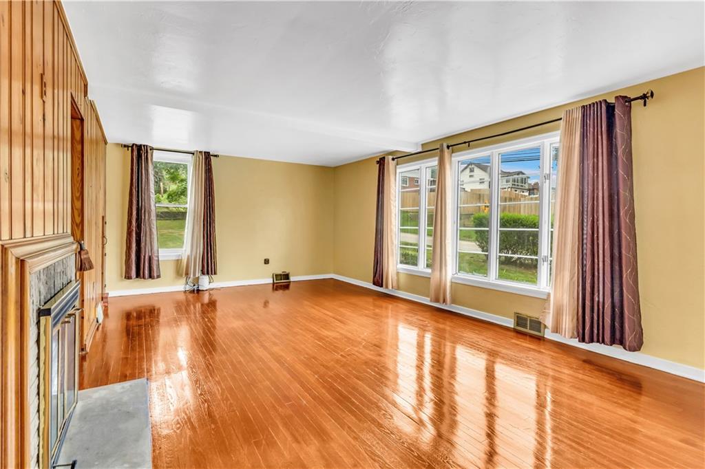 156 McIntyre Road Pittsburgh, PA 15237 - Photo 9 of 23 Inviting living room with gleaming hardwood floors.