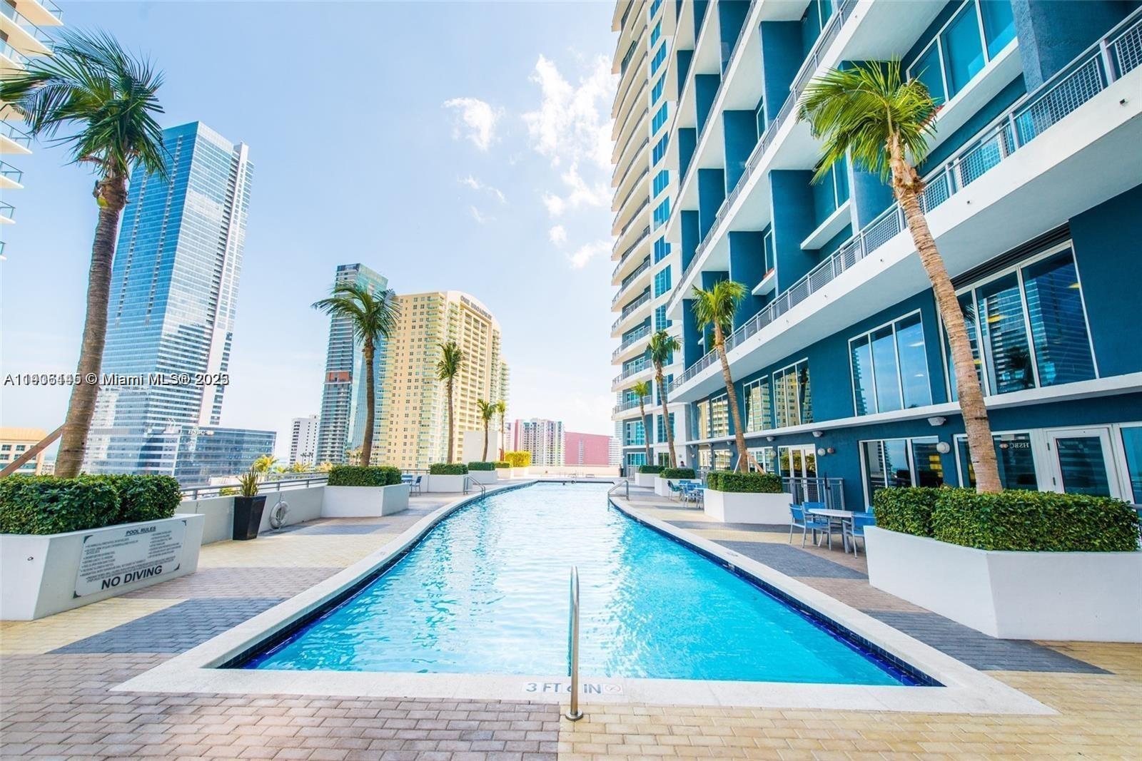60 Southwest 13th Street, Unit 3606 Miami, FL 33130 - Photo 18 of 22 a view of an buildings with swimming pool