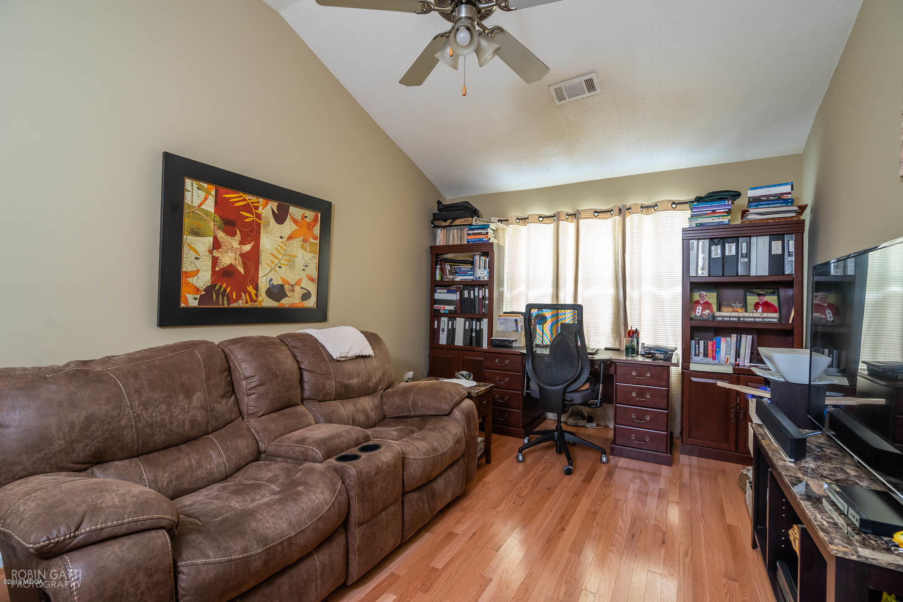 234 Autumn Ridge Court Gray, GA 31032 - Photo 13 of 24 a living room with furniture a bookshelf and a book shelf