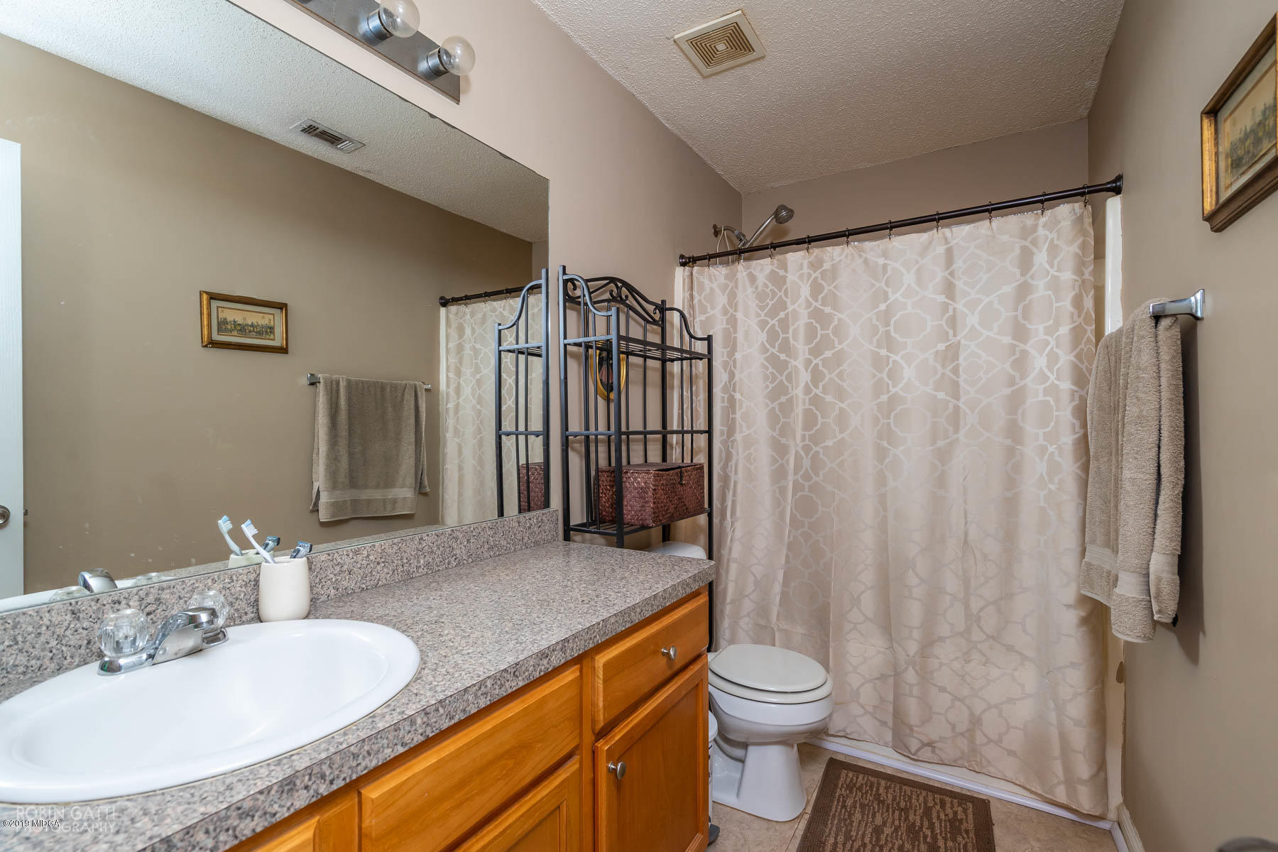 234 Autumn Ridge Court Gray, GA 31032 - Photo 19 of 24 a bathroom with a granite countertop sink toilet and shower