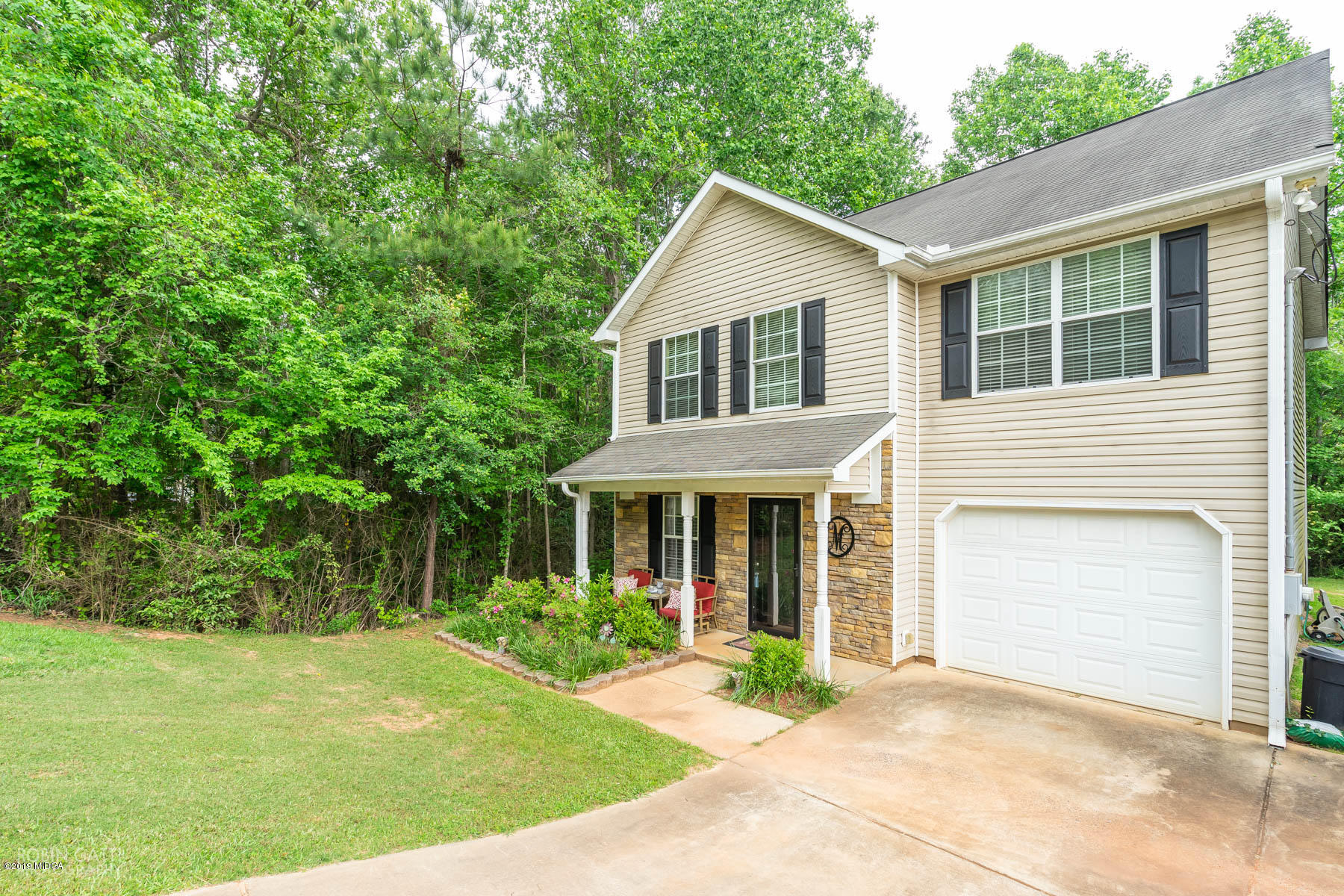 234 Autumn Ridge Court Gray, GA 31032 - Photo 3 of 24 a front view of a house with a yard and potted plants