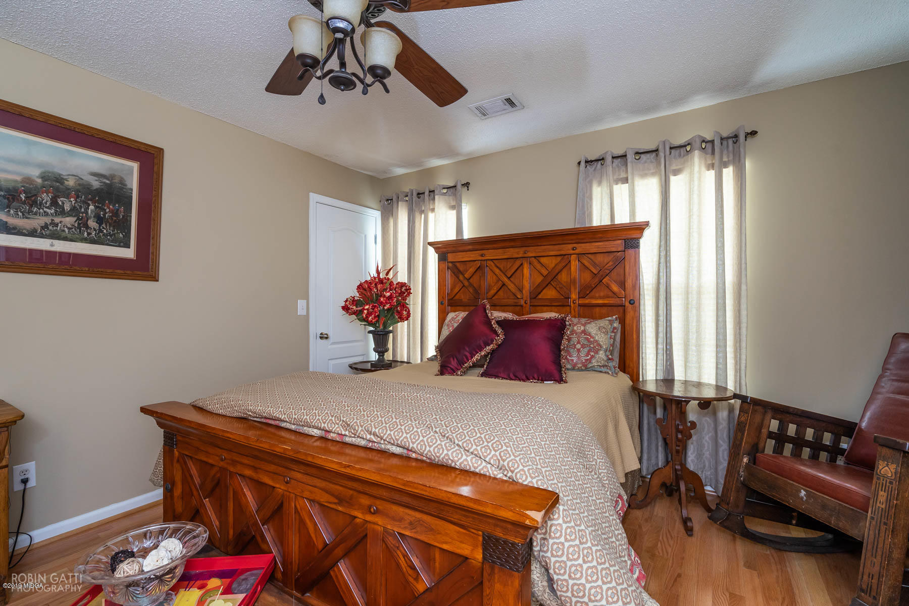234 Autumn Ridge Court Gray, GA 31032 - Photo 21 of 24 a bedroom with a bed and dresser with wooden floor