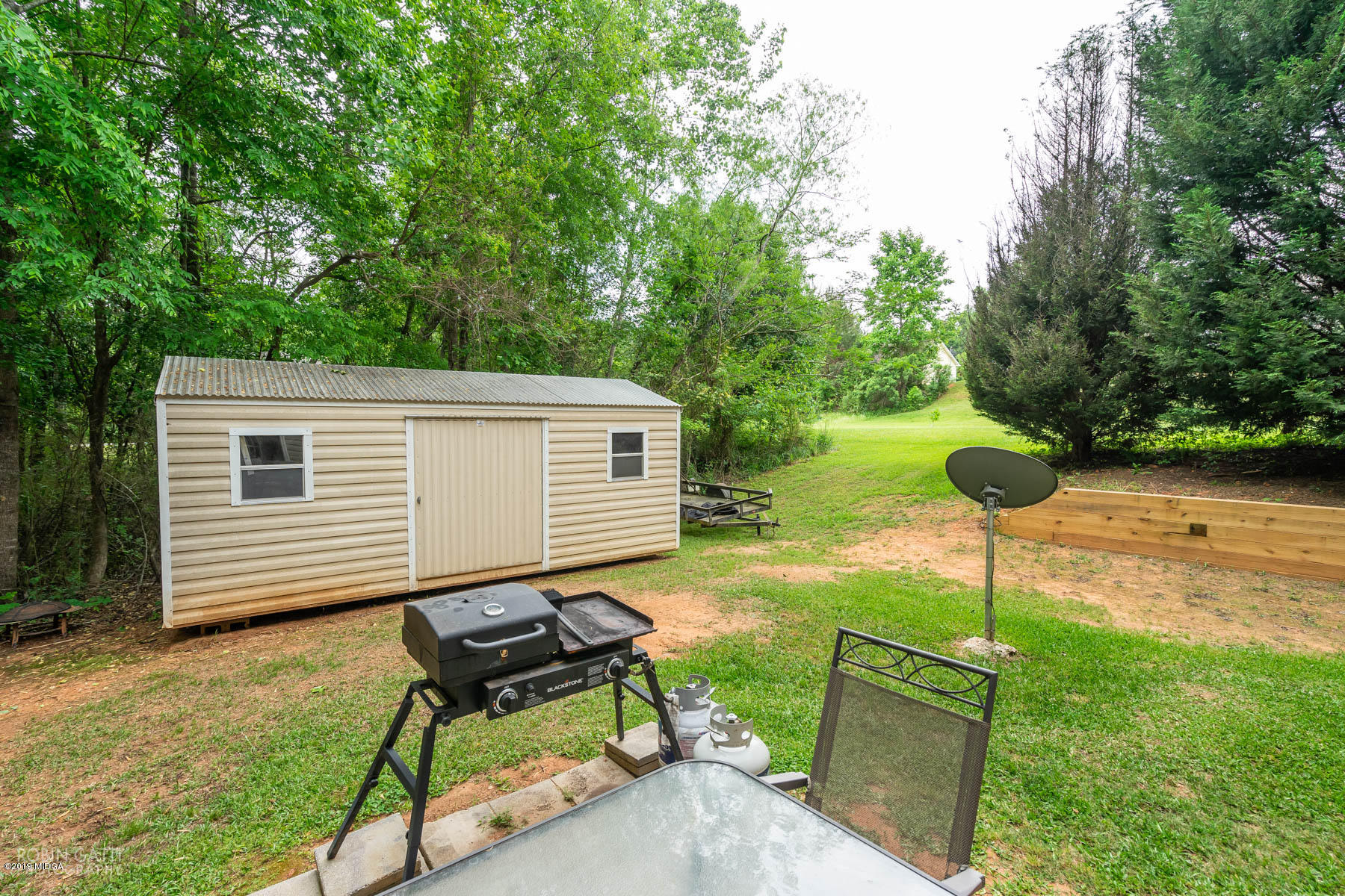 234 Autumn Ridge Court Gray, GA 31032 - Photo 22 of 24 a backyard of a house with table and chairs