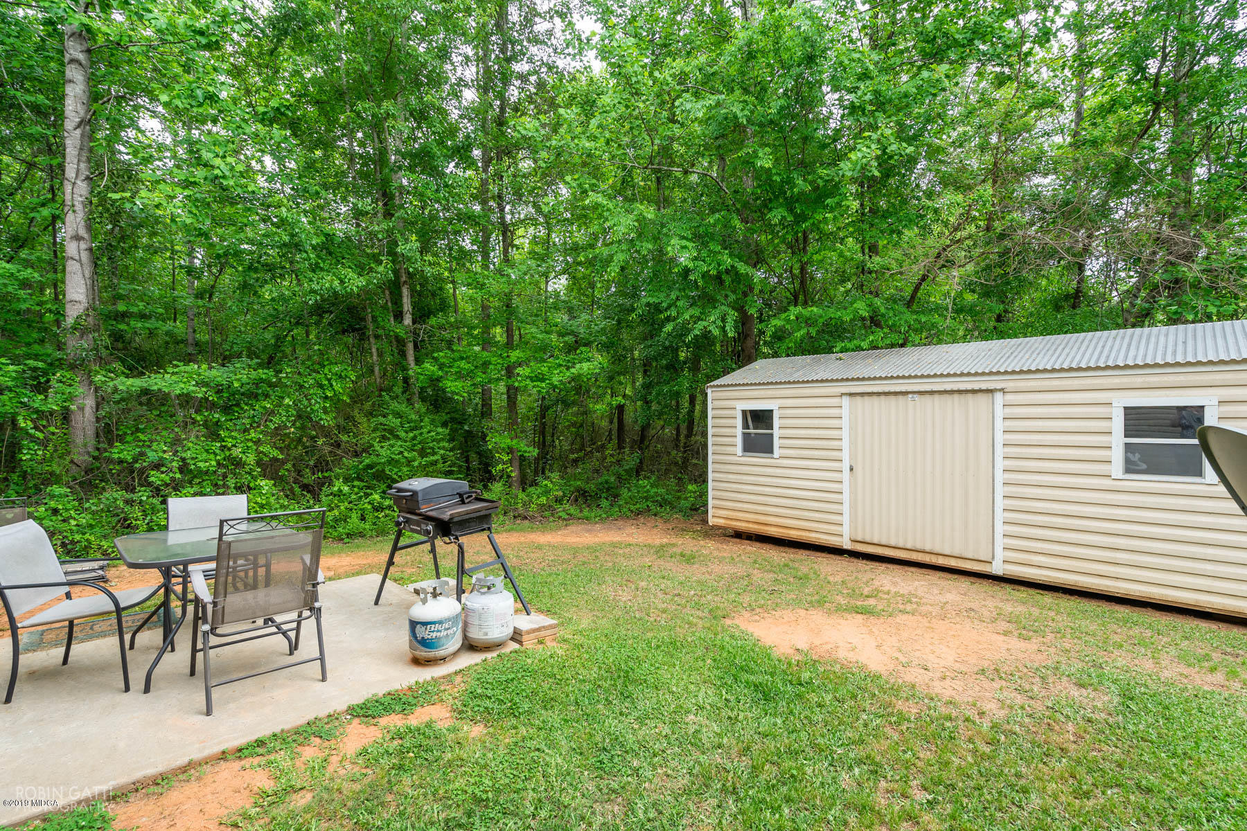 234 Autumn Ridge Court Gray, GA 31032 - Photo 23 of 24 a view of a backyard with a sitting area