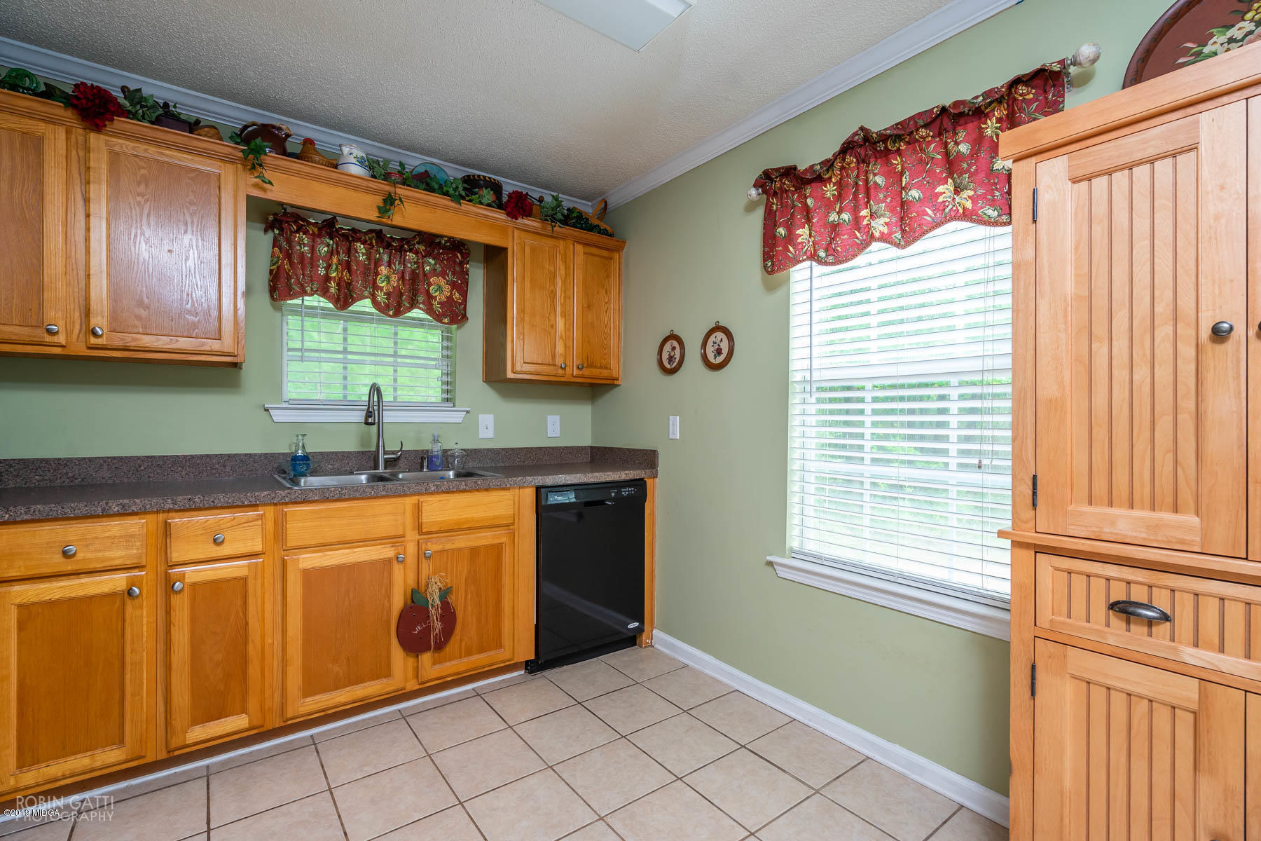 234 Autumn Ridge Court Gray, GA 31032 - Photo 10 of 24 a kitchen with stainless steel appliances granite countertop a sink a microwave cabinets and a window