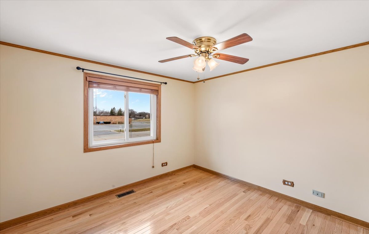 313 Springinsguth Road Schaumburg, IL 60193 - Photo 13 of 39 a view of empty room with wooden floor