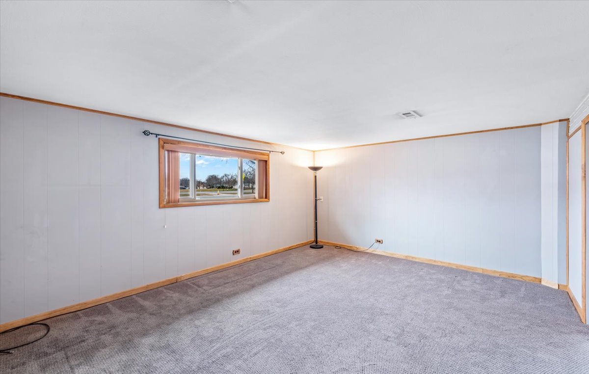 313 Springinsguth Road Schaumburg, IL 60193 - Photo 19 of 39 a view of an empty room with a window
