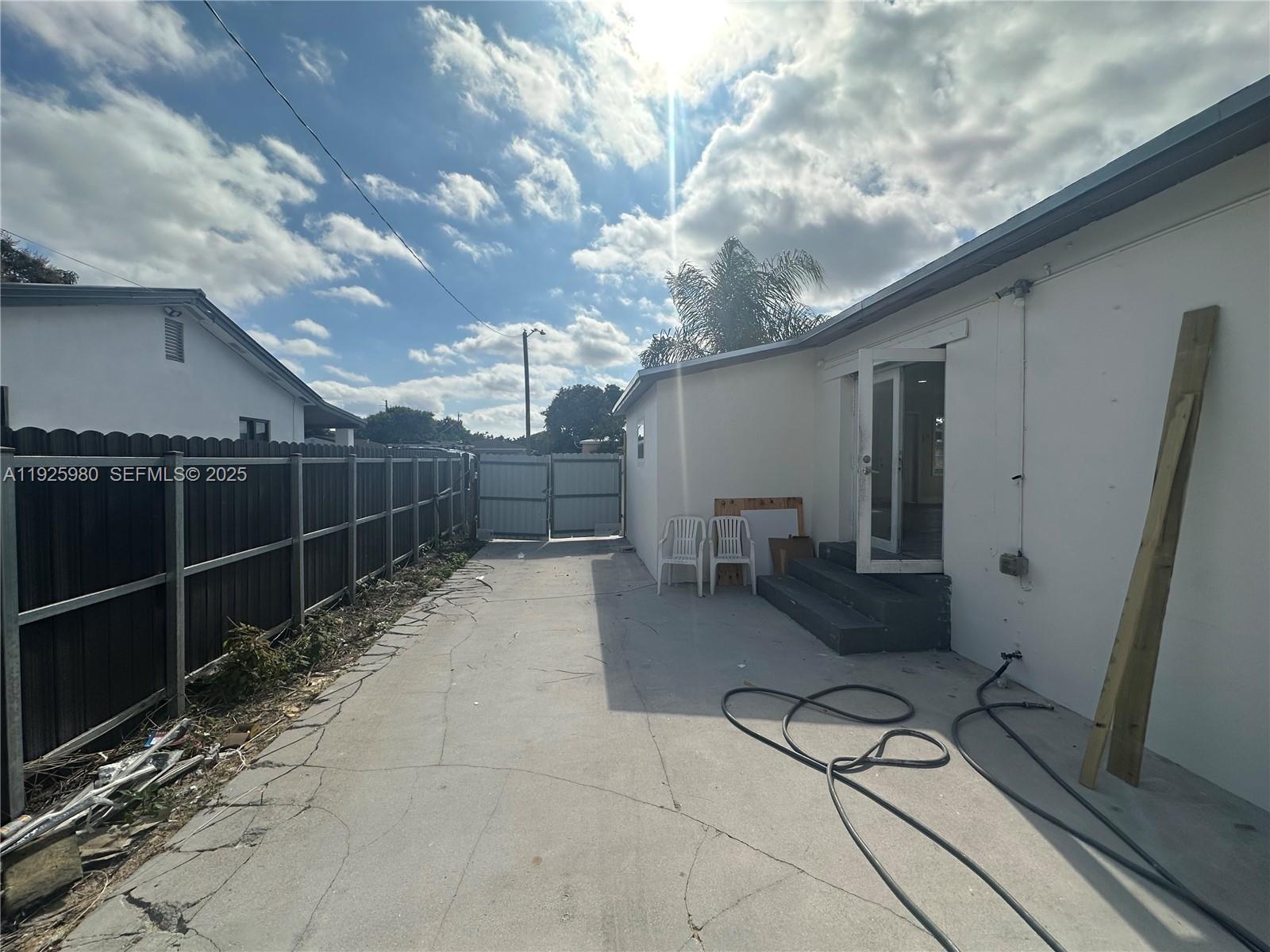 659 East 19th Street, Unit 659 Hialeah, FL 33013 - Photo 11 of 26 a view of a porch with furniture and a yard