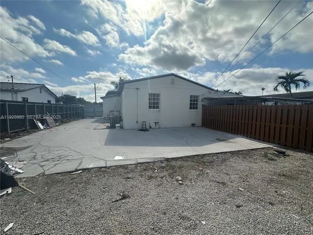 a view of a backyard of the house