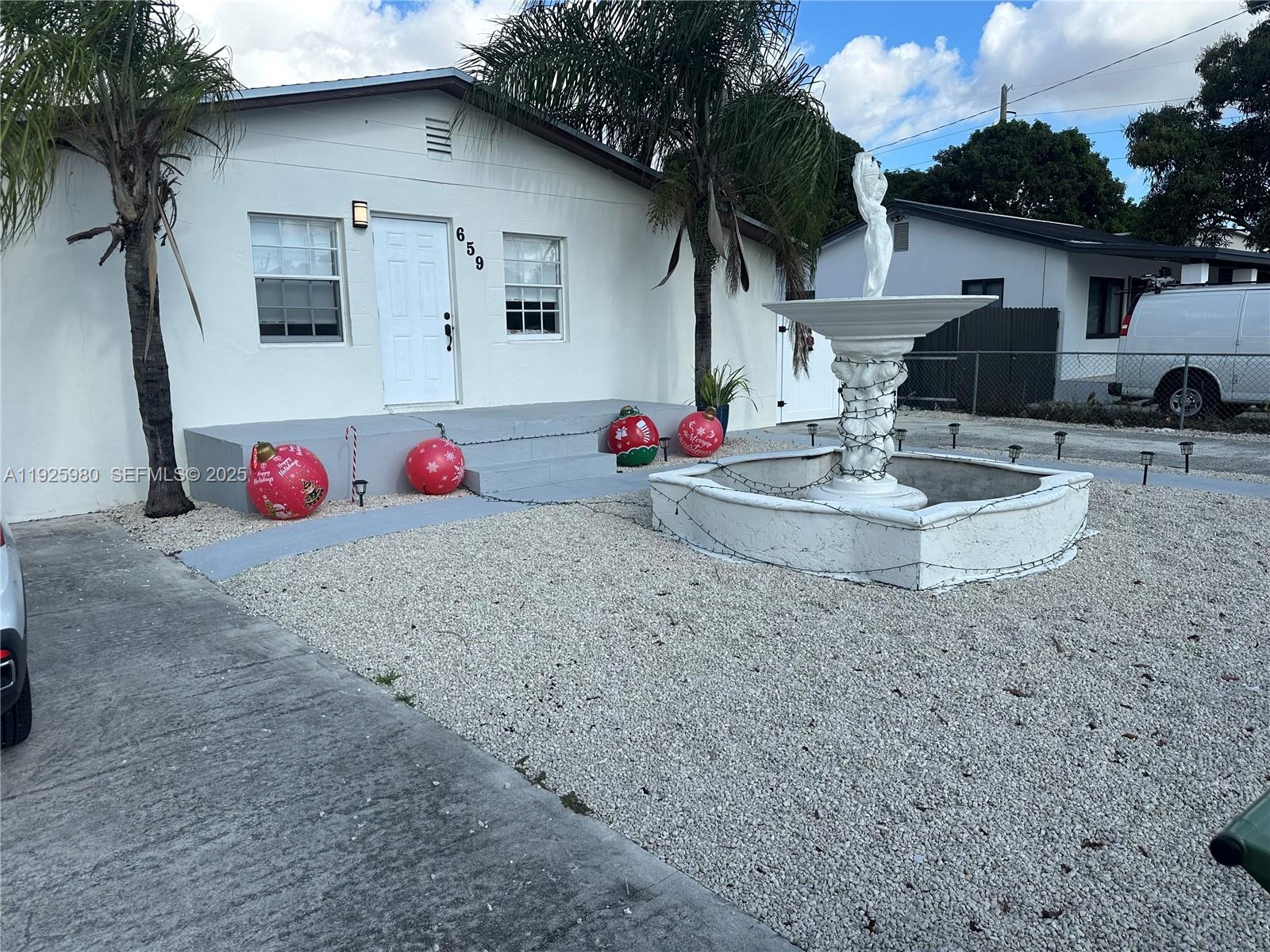 659 East 19th Street, Unit 659 Hialeah, FL 33013 - Photo 2 of 26 a front view of house with yard
