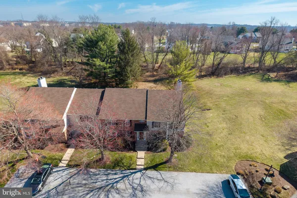 an aerial view of a house with a yard lake view and mountain view
