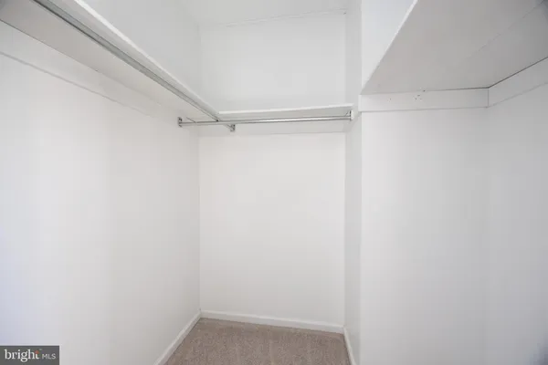a view of an empty walk in closet