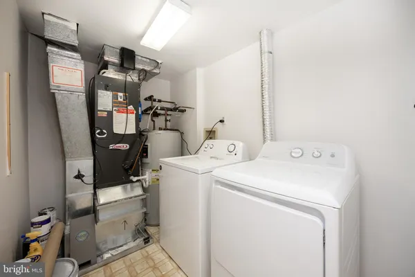 a view of storage and utility room with washer and dryer