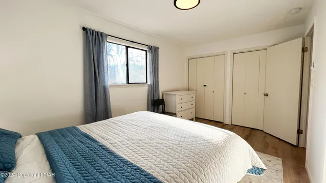 a bedroom with a workspace