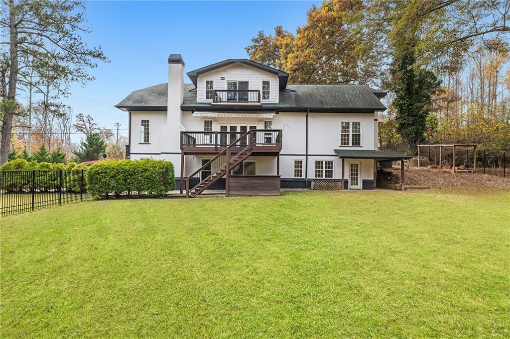 14440 Cogburn Road Alpharetta, GA 30004 - Photo 47 of 62 a front view of a house with a yard
