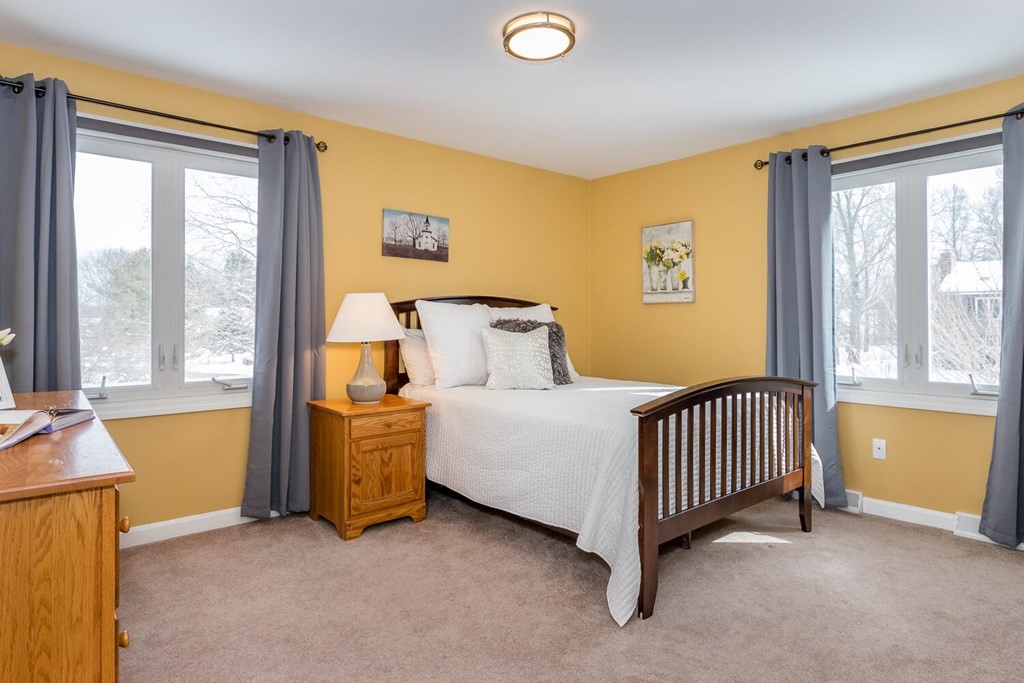 38 Clover Lane Stoughton, MA 02072 - Photo 13 of 21 a bed room with a bed and a window