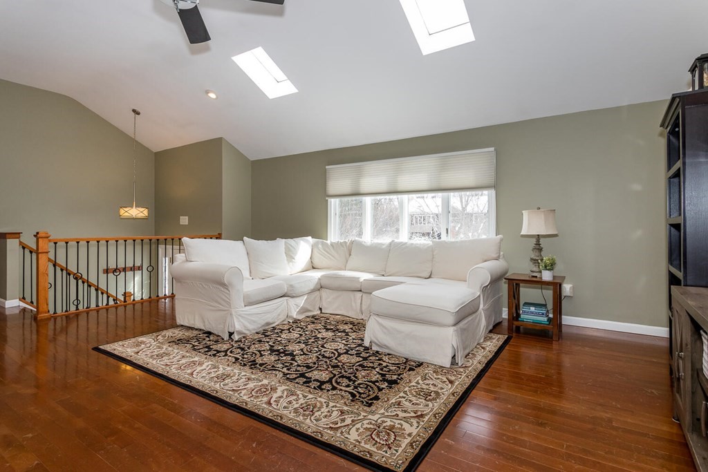 38 Clover Lane Stoughton, MA 02072 - Photo 4 of 21 a living room with furniture and a table