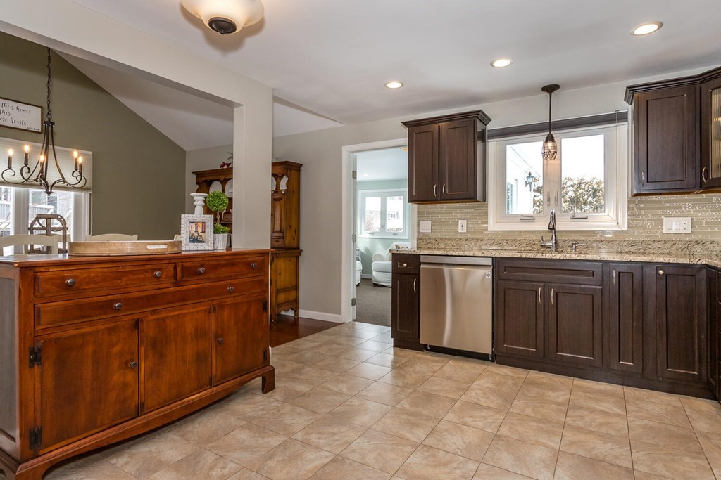 38 Clover Lane Stoughton, MA 02072 - Photo 9 of 21 a kitchen with a sink and a stove