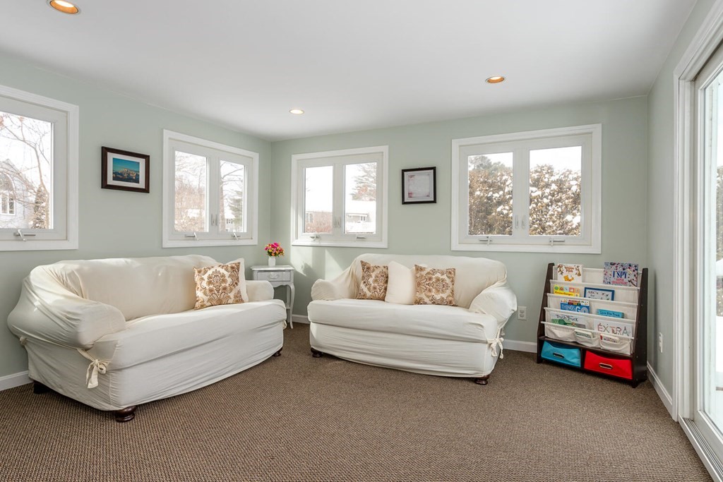 38 Clover Lane Stoughton, MA 02072 - Photo 10 of 21 a living room with furniture and a large window