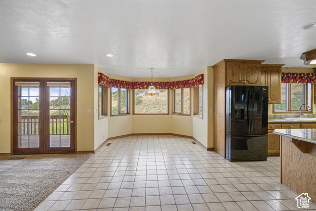 1373 Pheasant Ridge Circle Bountiful, UT 84010 - Photo 14 of 50 Tiled flooring with bay windows, wood cabinetry, and a built-in refrigerator