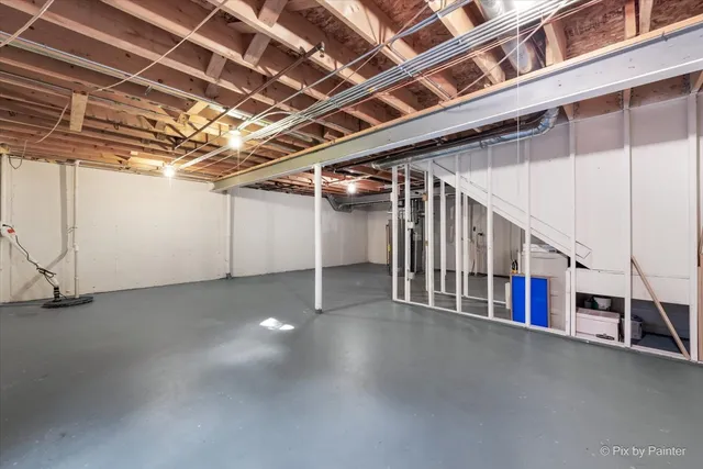 a view of an empty room with stairs