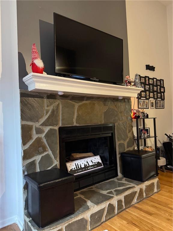 1019 Davis Mill Road South Dallas, GA 30157 - Photo 14 of 16 a living room with a fireplace and a flat screen tv