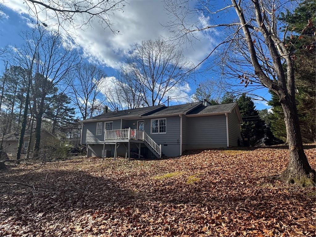 1019 Davis Mill Road South Dallas, GA 30157 - Photo 2 of 16 a front view of house with yard and trees