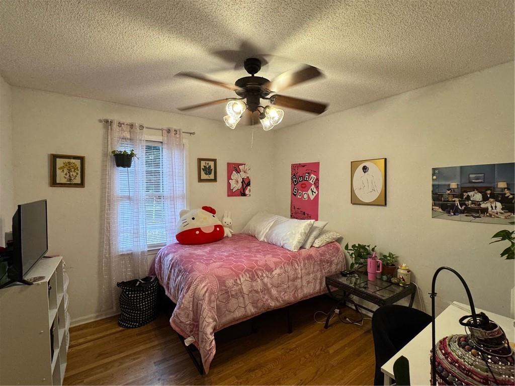 1019 Davis Mill Road South Dallas, GA 30157 - Photo 8 of 16 a bedroom with a bed and a flat screen tv