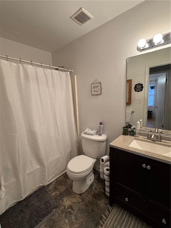1019 Davis Mill Road South Dallas, GA 30157 - Photo 9 of 16 a bathroom with a sink toilet and shower