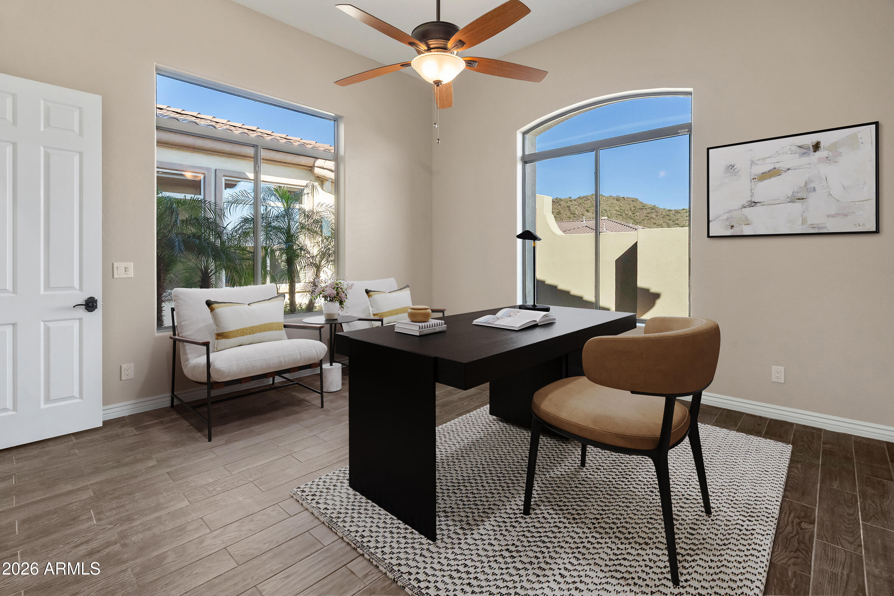 42420 North Back Creek Way Anthem, AZ 85086 - Photo 5 of 70 a living room with furniture a table and a large window